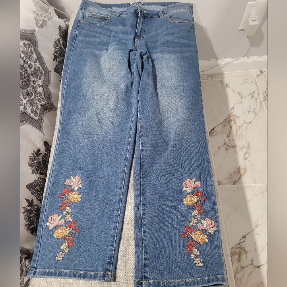 Embroidered stretch jeans waist is 37 inches, inseam is 27 inches.